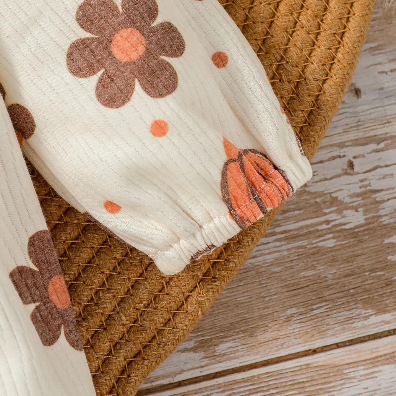 Graceful Pumpkin and Floral Printed Baby Jumpsuit