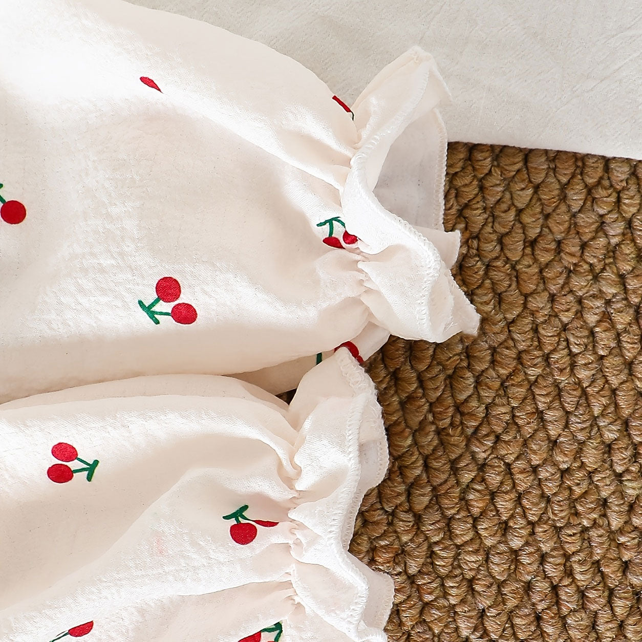 All-Over Cherry Printed Crochet Collar Long Sleeve Baby Jumpsuit